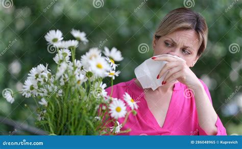 Woman Allergic To Wild Spring Flowers and Holding Bouquet in Hands Stock Image - Image of ...