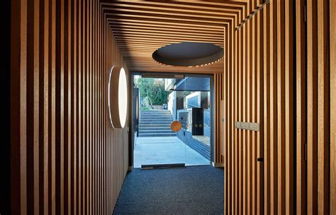 Oversized circular windows dominate the facade of Cirqua Apartments in Melbourne