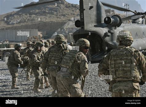 Soldiers Of The 4th Stryker Brigade Combat Team 2nd Infantry Divisions Unload Baggage From A