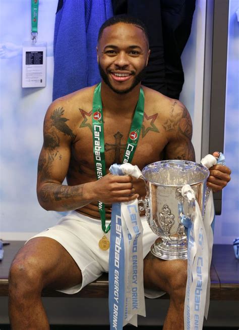 Raheem Sterling Of Manchester City Poses With The Trophy After