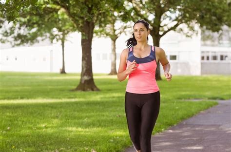 Premium Photo Fit Brunette Jogging In The Park