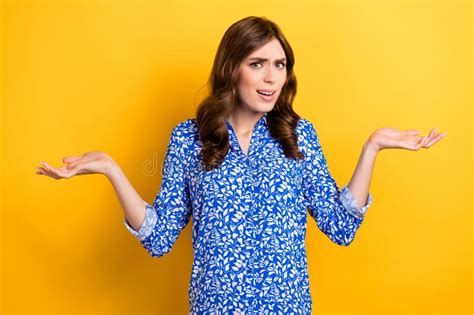 Photo Of Shocked Puzzled Lady Wear Print Shirt Rising Arms Shrugging Shoulders Isolated Yellow