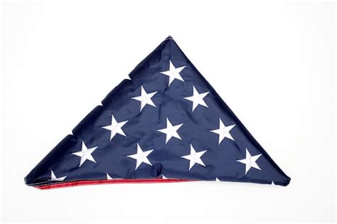 Premium Photo | Folded flag of the united states on white background. memorial day