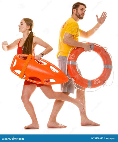 Lifeguards Running With Rescue Ring Buoy On Duty Stock Photo Image