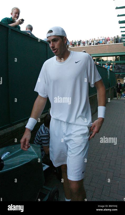 AN EXHUASTED JOHN ISNER WIMBLEDON WIMBLEDON LONDON ENGLAND 23 June 2010 ...