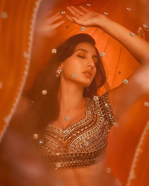 Nora Fatehi Looks Sensuous In Orange Lehenga Share Photo On Social Media Nora Fatehi तारो