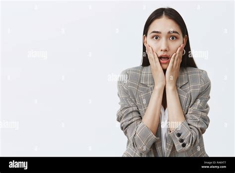 Waist Up Shot Of Stunned Speechless Cute Woman In Fashionable Jacket