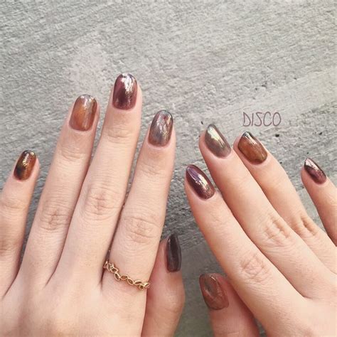 Two Hands With Manicured Nails And Gold Rings