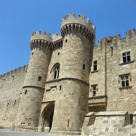 An Old Castle With Stone Walls And Towers