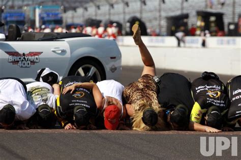 Fay Menard Kisses The Bricks Surrounded At The Brickyard 400 In