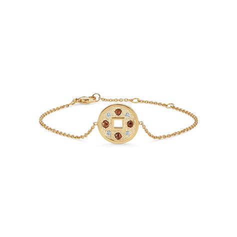 Talisman bracelet in yellow gold | De Beers US