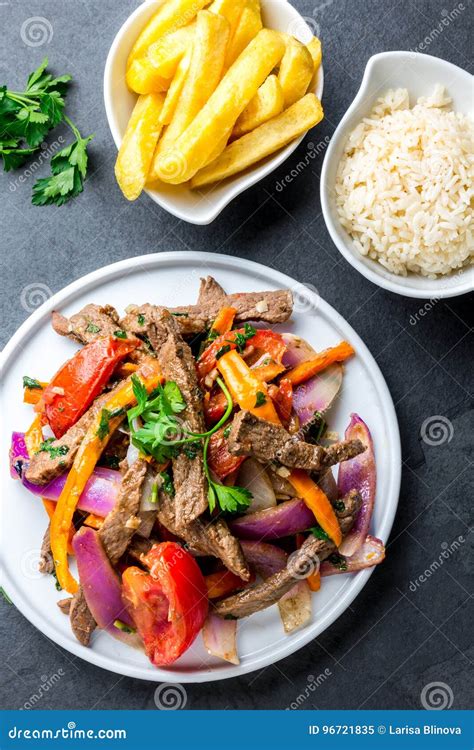 Peruvian Dish Lomo Saltado Beef Tenderloin With Purple Onion Yellow