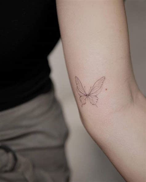 Fine Line Style Butterfly Tattoo Placed On The Inner