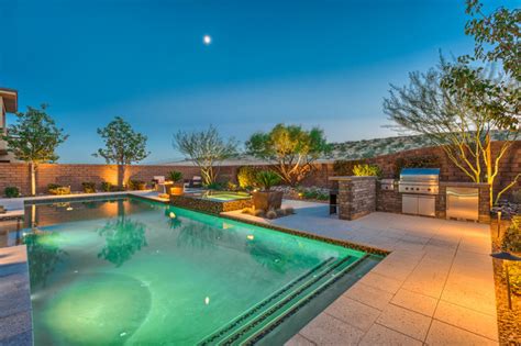 Lap Pool With Rim Flow Spa Fire Pit Tropical Pool Las Vegas