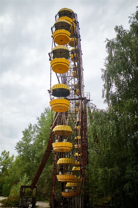 Old Abandoned Ferris Wheel In The Amusement Park In The Ghost Town