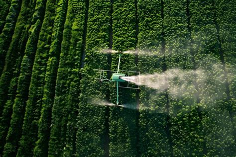 Premium Photo | Enhancing Agricultural Efficiency with Aerial Pesticide Spraying by Drones ...