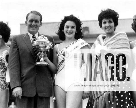 Christina Mayo Stands With Her Cup And Two Of The Judges Johnny