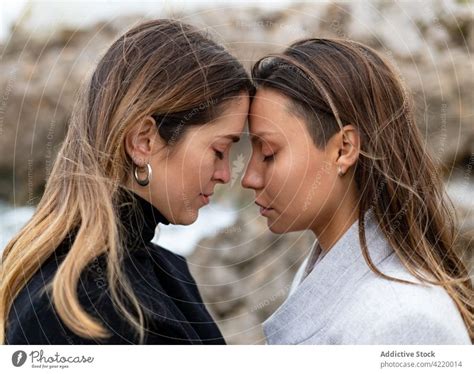 Homosexual Couple Of Women Standing On Sea Shore A Royalty Free Stock