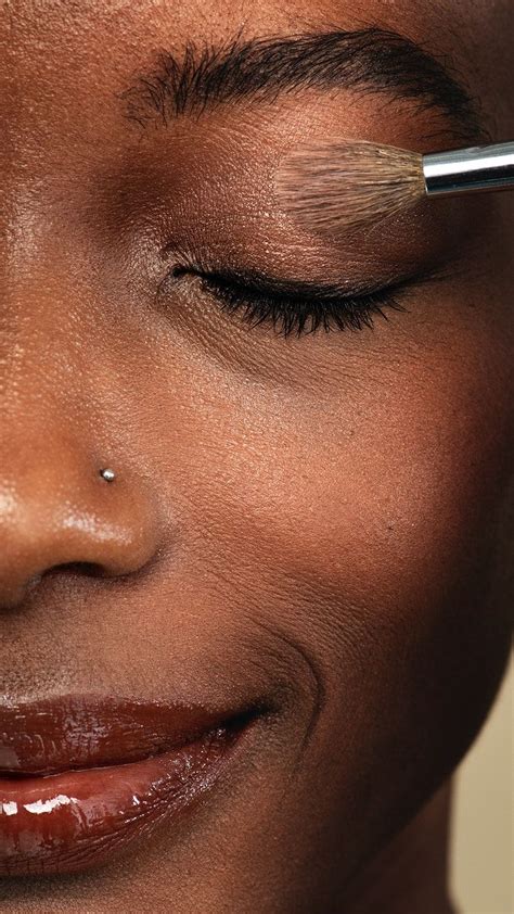 Makeup Artist Applying Eye Shadow On A Black Woman Premium Image By Jira