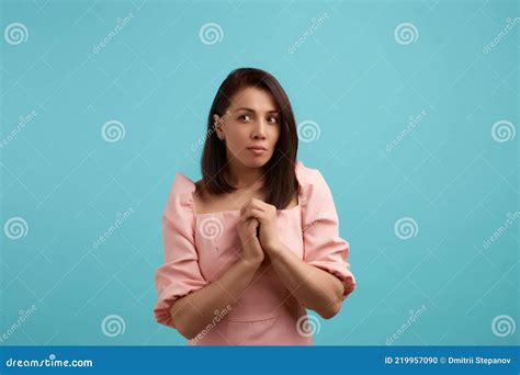 Curious Woman In Pink Dress Keeps Hands Near Her Chest Heard Someones Conversation About Her