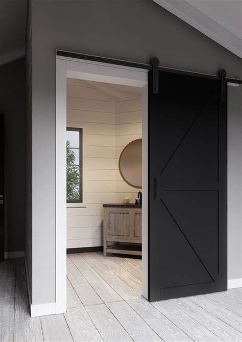 An Open Door Leading Into A Room With White Walls And Wood Flooring On