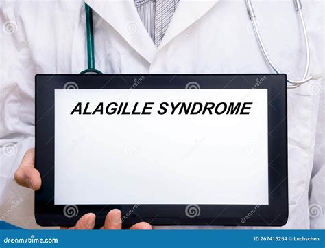 Alagille Syndrome Doctor With Rare Or Orphan Disease Text On Tablet