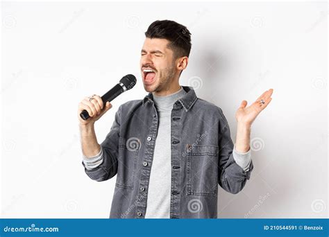 Handsome Guy Singing In Mic With Passion Perform For Audience Holding