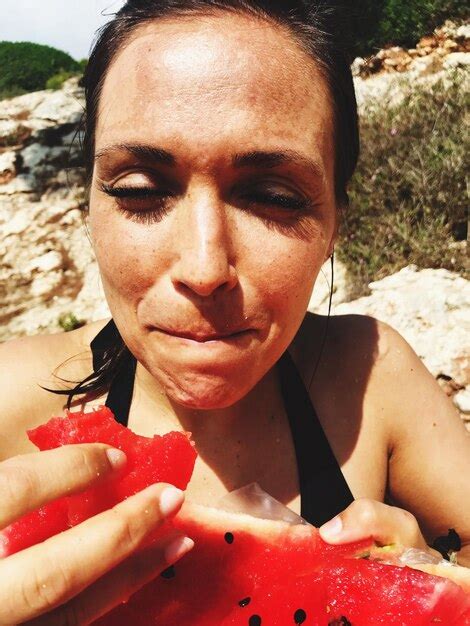 Premium Photo Woman Eating Watermelon Outdoors