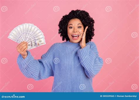 Photo Of Impressed Funky Woman Wear Blue Pullover Rising Dollars Fan