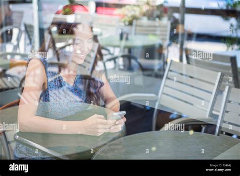 Pretty Brunette Sending A Text Stock Photo Alamy