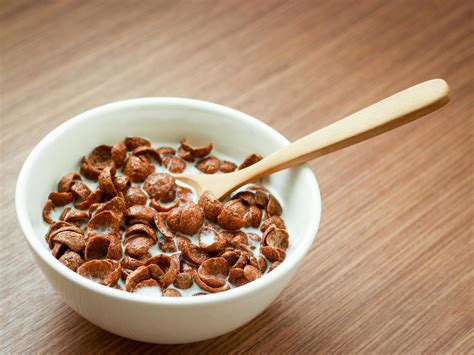 Cereal Chocolate Flavor With Spoon And Milk In Whith Bowl On Wooden