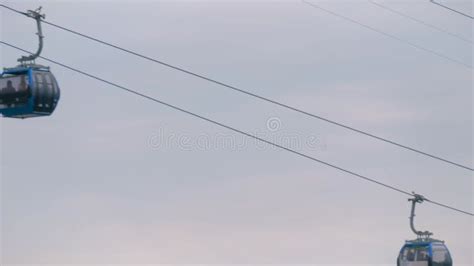 Ropeway Cable Car Cabins Are Moving Against Gray Sky In Batumi Stock