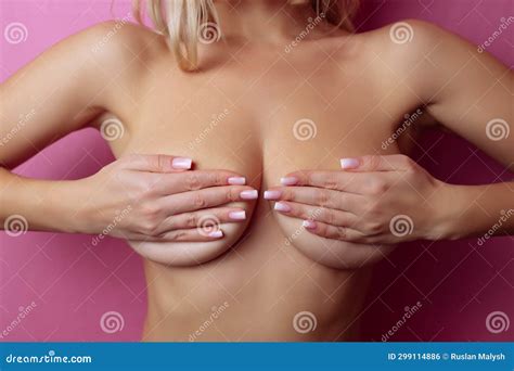 Big Breasts Close Up Naked Woman Posing Isolated On A Pink Background Stock Photo Image Of