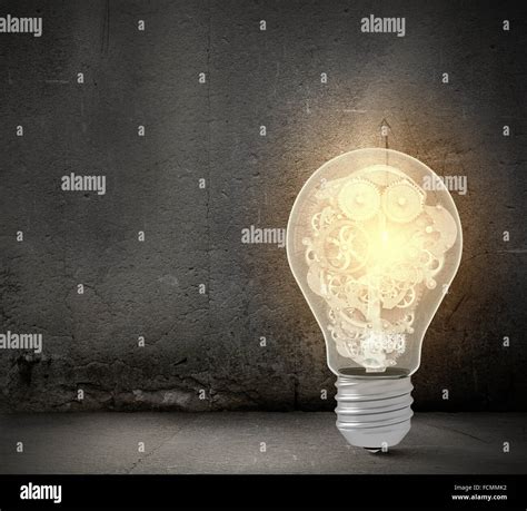 Close Up Of Light Bulb And Gears Mechanism Stock Photo Alamy