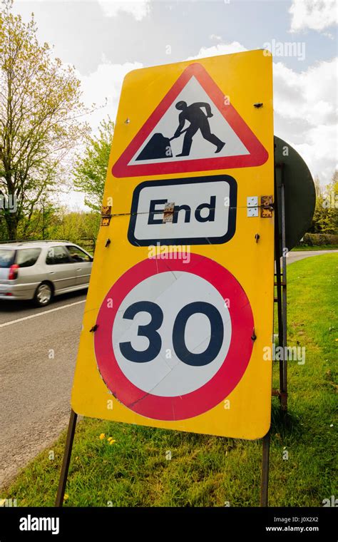 Temporary Speed Restriction End Of Road Works Sign Showing 30 Miles Per