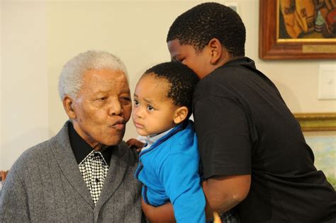 Nelson Mandela celebrating his 94th birthday with members of his family ...