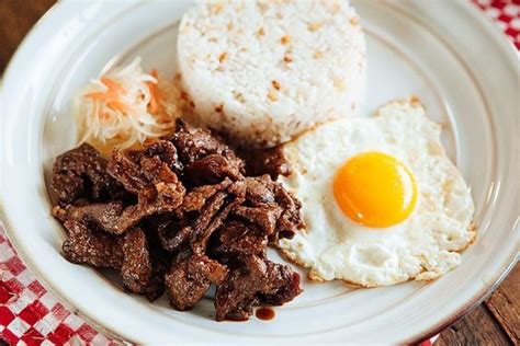 Sweet Spicy Tapa Queen Marinated Beef Sirloin Served With Garlic Rice Fried Egg And Atchara