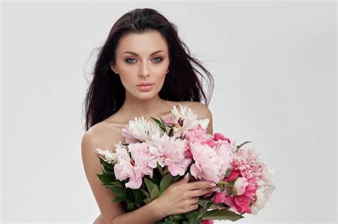 Premium Photo Sexy Brunette Woman Holding A Large Bouquet Of Peony