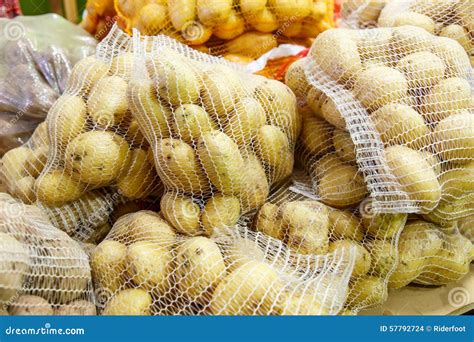 Potatoes in the Mesh Bags from a Market Stock Photo - Image of onion ...