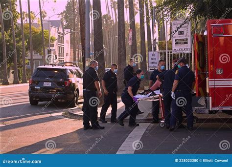 Los Angeles Police And Firefighters Load Patient Into Ambulance