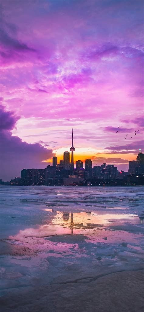 Purple Sunset Over City Buildings 4K Phone Wallpaper