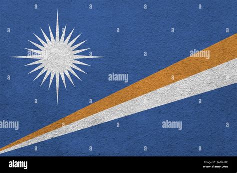 Marshall Islands Flag Depicted In Bright Paint Colors On Old Relief