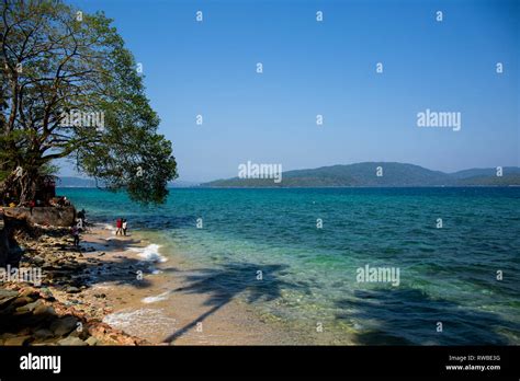 Tourists on a picturesque beach on Ross Island, officially known as ...