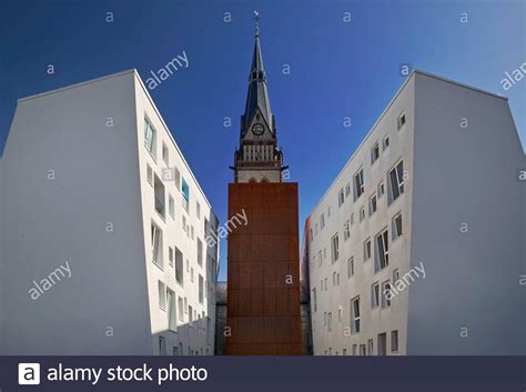 Steeple Of The Christuskirche Behind Modern Apartment Buildings