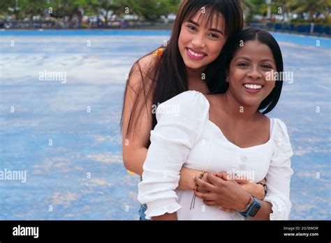 Two Latina Friends Hugging Each Other In The City Stock Photo Alamy