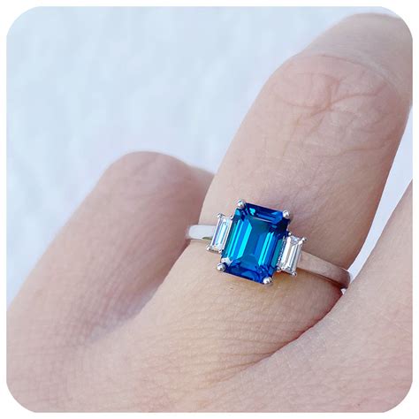 Lisa Emerald Cut London Blue Topaz And Moissanite Engagement Ring Victorias Jewellery