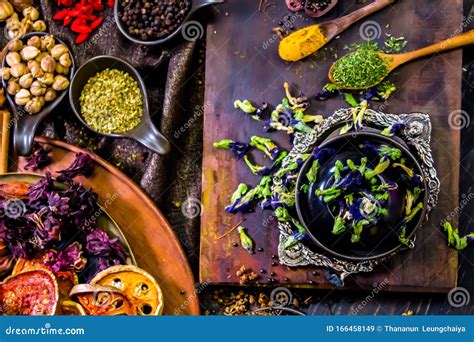 Top View Spices And Herbs Ingredient Decoration On Wood Table For Cook