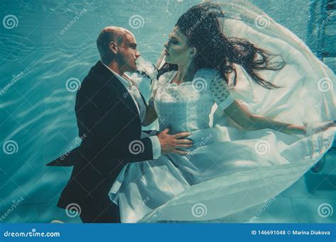 Beautiful Romantic Couple Of Bride And Groom After Wedding Swimming