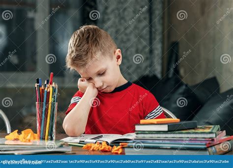 The Little Boy Is Sad Bored To Do Homework Stock Photo Image Of