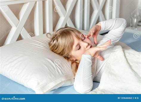 Cute Little Blond Caucasian Girl Awakening At Bed In Morning Child